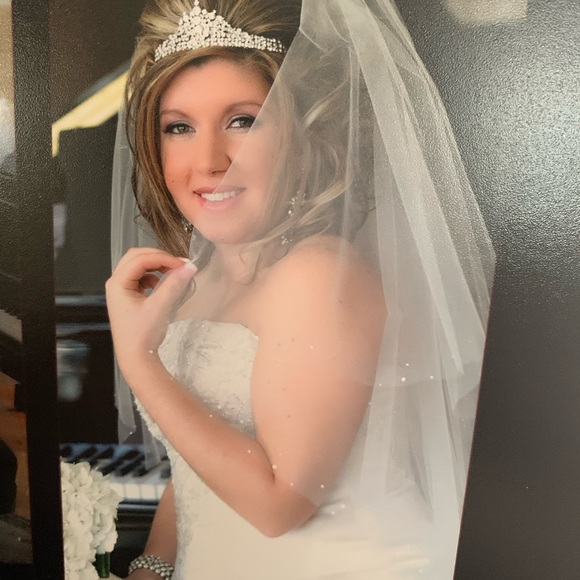 Wedding headpiece filled with Swarovski crystals .